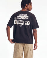 Mixed Emotions Stamped Tee black, upper body rear view on model showing the stamped MIXED EMOTION lettering