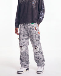 Triple Sevens Camo Sweatpants grey, waist-down front view on model showing the camo print and patches