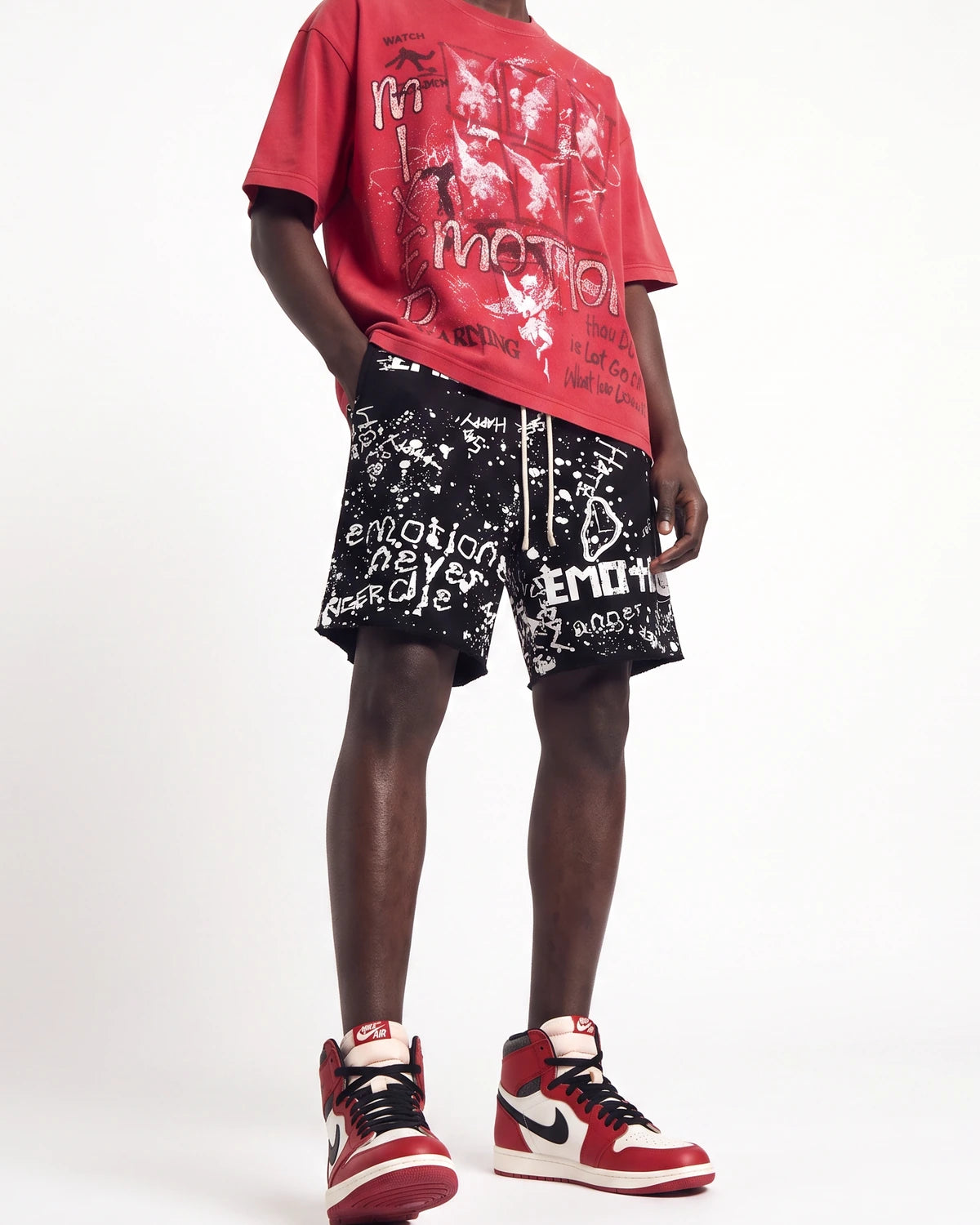 Mixed Emotions Graffiti Shorts black, waist-down front view on model showing the graffiti scrawls