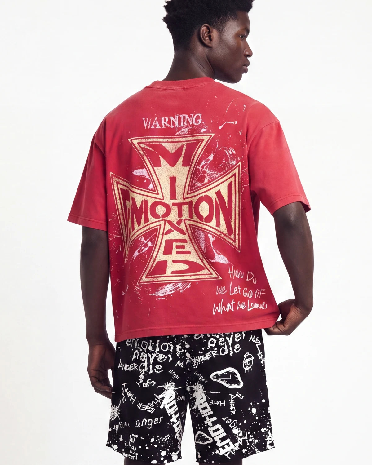 Mixed Emotions Crimson Tee red, upper body rear view on model showing the gold iron-cross back print