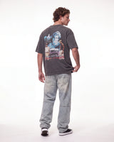 Triple Sevens Moto Denim Pants blue, full rear view on model worn with a washed black graphic tee