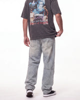 Triple Sevens Moto Denim Pants blue, waist-down rear view on model showing the light-wash denim