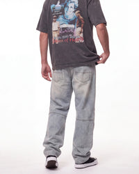Triple Sevens Moto Denim Pants blue, waist-down rear view on model showing the light-wash denim
