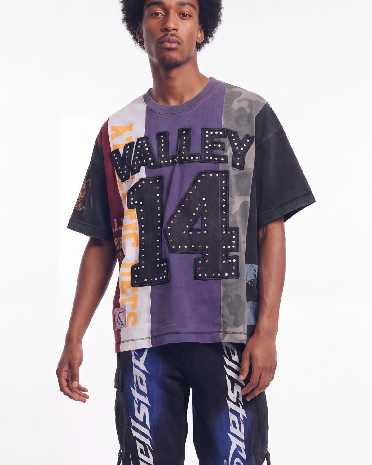 Vale Forever Chopped Tee black, upper body front view on model showing the purple and camo patchwork panels