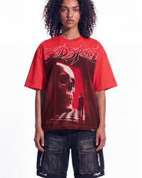 A model wearing a red Godspeed t-shirt with a large skull graphic and dark cargo shorts, photographed against a solid white background.