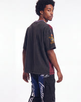 Vale Forever Chopped Tee black, upper body rear view on model showing the plain back and gold sleeve patch