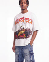 A man wearing a white graphic t-shirt with a red and yellow 'RDSPEECH' logo and a race car illustration, paired with blue cargo pants, against a plain white background.