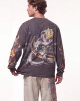 A man shown from the back wearing a dark gray long-sleeve t-shirt with a large graphic of Super Saiyan Gohan and the text 'ALLEY BREATHE FUTURE' across the back, paired with light beige pants.
