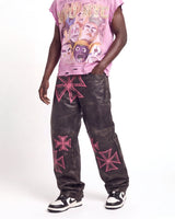 Vale Forever Croxxx Leather Pants bubblegum black and pink, waist-down front view on model showing the pink cross appliqués