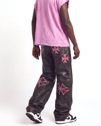 Vale Forever Croxxx Leather Pants bubblegum black and pink, waist-down rear view on model showing the cross appliqués
