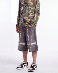 Bravest Studios Sapphire Jorts black, waist-down front view on model showing the jeweled cross appliqués