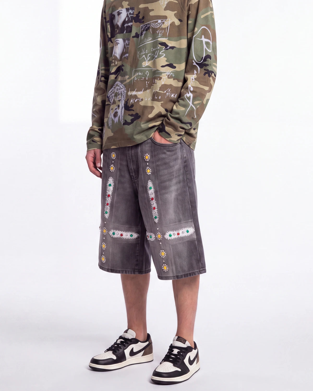 Bravest Studios Sapphire Jorts black, waist-down front view on model showing the jeweled cross appliqués