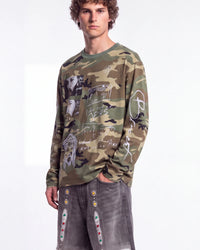 Bravest Studios Shepherd LS Tee camo green, upper body front view on model showing the camo and photo prints