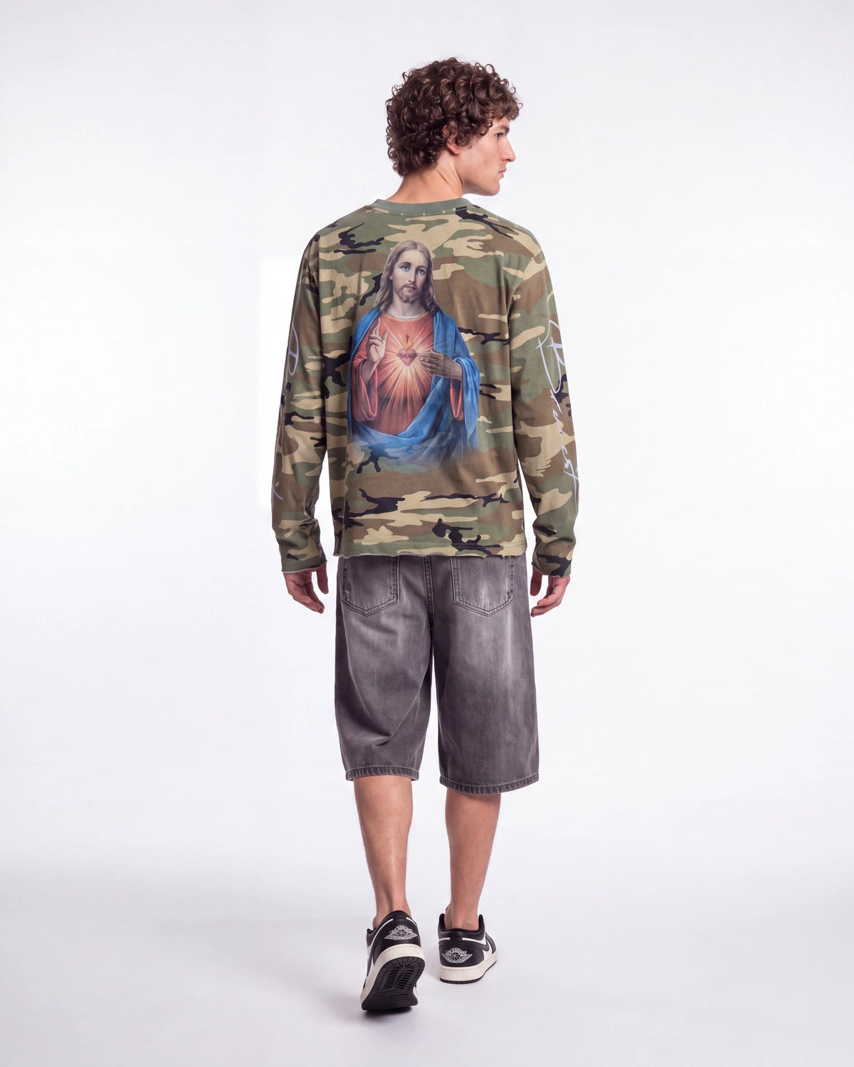 Bravest Studios Shepherd LS Tee camo green, full rear view on model showing the Sacred Heart back print