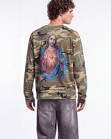 Bravest Studios Shepherd LS Tee camo green, upper body rear view on model showing the Sacred Heart print
