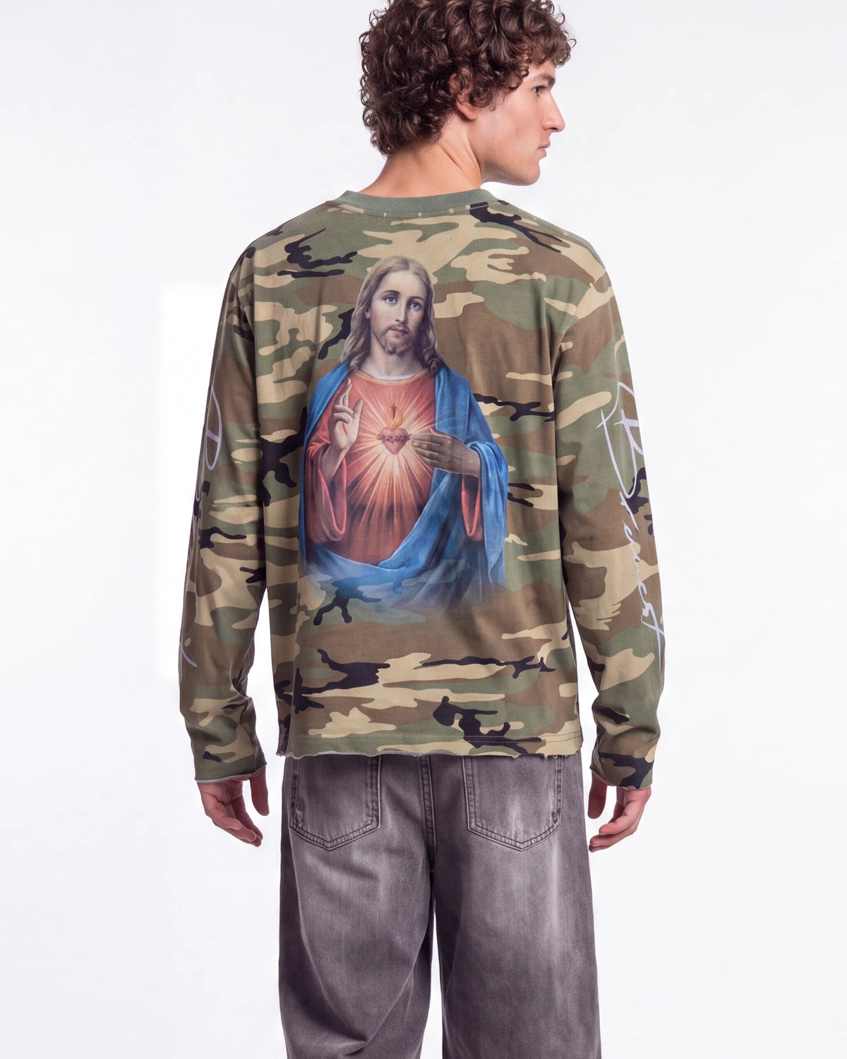 Bravest Studios Shepherd LS Tee camo green, upper body rear view on model showing the Sacred Heart print