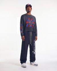 HMDD Orange Waxed Round 10 Hat navy, worn on model with a long sleeve tee and track pants, front view