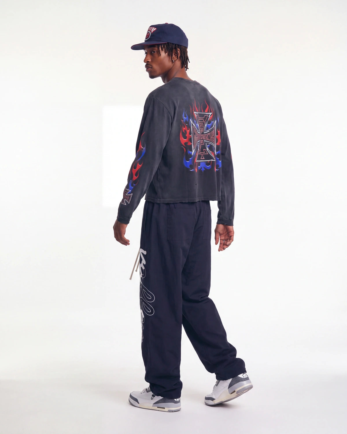 HMDD RWB 4th L/S Tee black worn with Vale Forever Midnight Swish track pants, rear three-quarter view on model