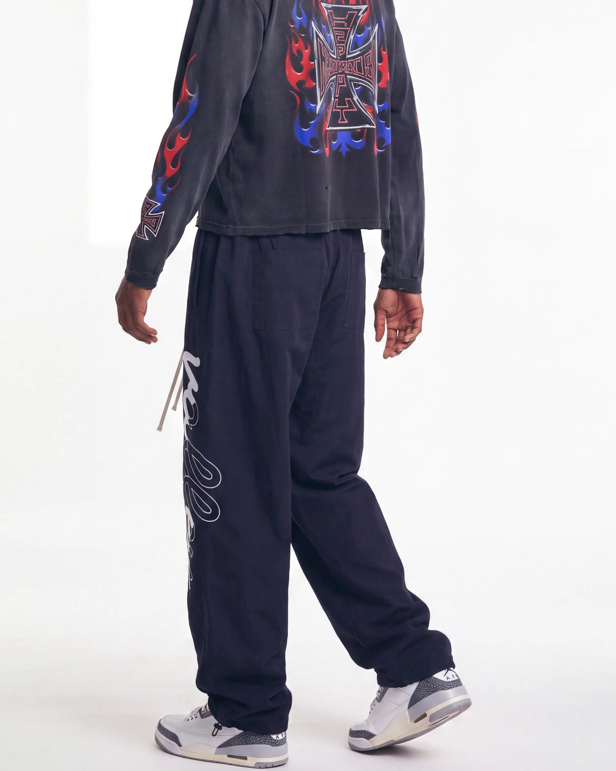 Vale Forever Midnight Swish Track Pants black, worn on model with the white Valley script visible down the leg