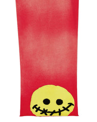 All Human 2+2=5 V2 Sweatsuit red wash, close-up of the stitched smiley patch on the pant leg