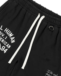 All Human 7am Shorts V2 black, close-up of the drawcord waist and collegiate print