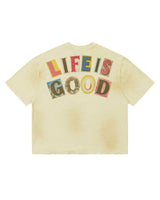 All Human Copy & Paste Tee cream, back view showing LIFE IS GOOD in multicolor cut-out lettering