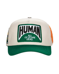 All Human Coronao V2 Trucker Hat Cream/Green, cream trucker with a green brim and HUMAN patch, front view