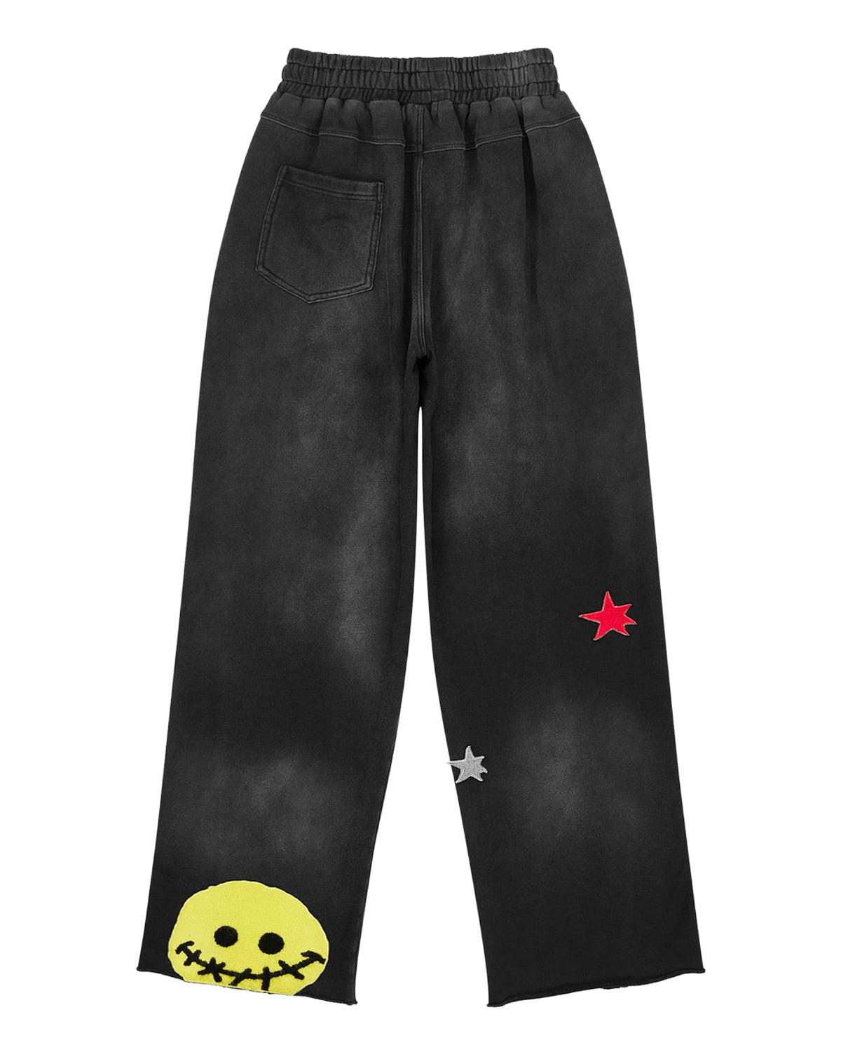 All Human Deli Set V2 Sweatsuit black wash, sweatpants back view with smiley patch at the hem