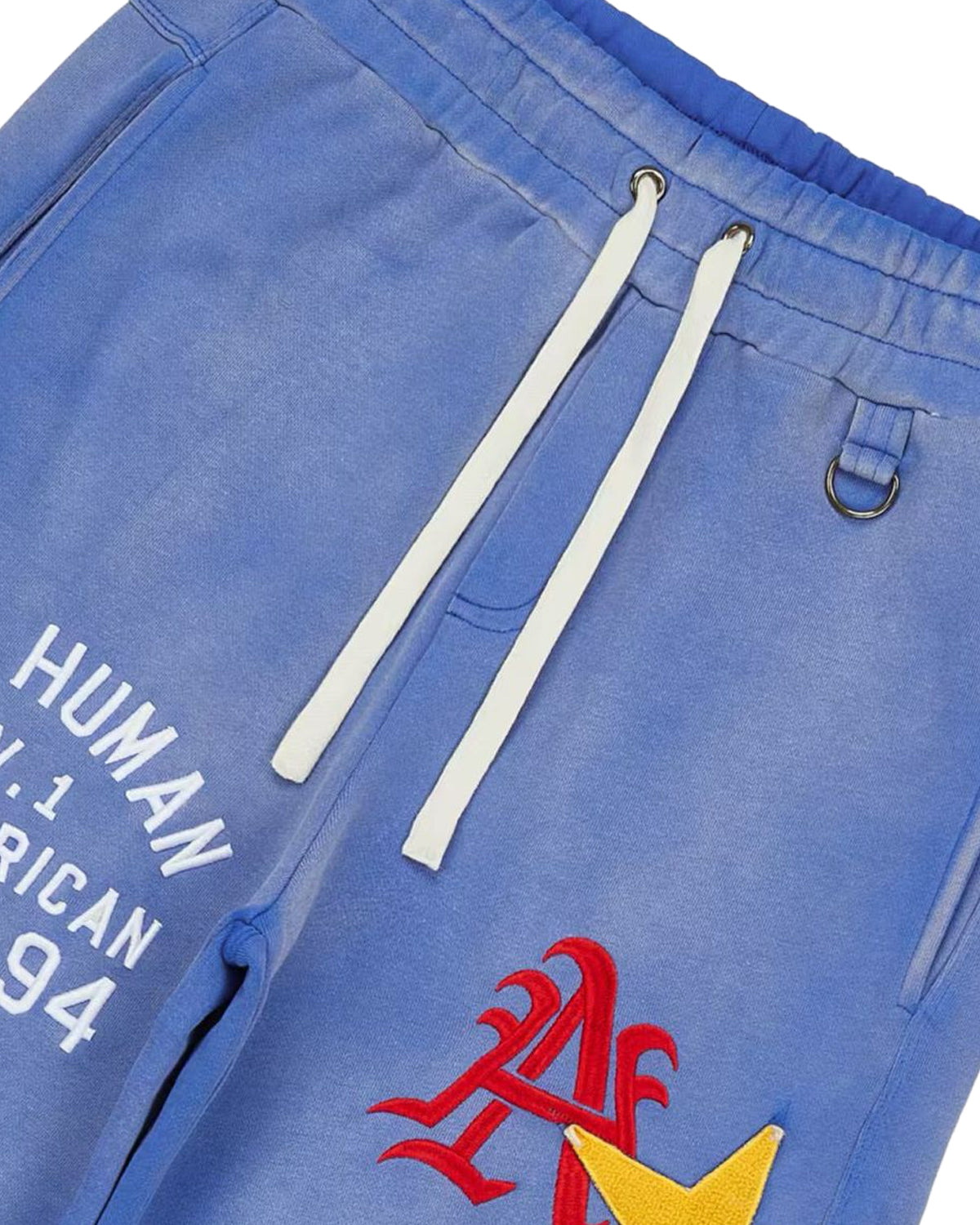 All Human El Perro Set V2 Sweatsuit blue wash, close-up of the drawstring waistband and embroidered patches