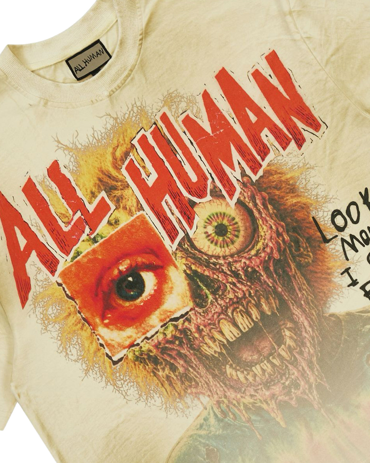 All Human Golden Years Tee cream, close-up of the front zombie face graphic and woven All Human neck label