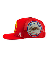 All Human Human After All V2 Trucker Hat Red, close-up of the embroidered side panel