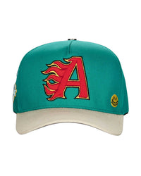 All Human Kilos V2 Trucker Hat Green/White, teal green trucker with a cream brim and red flaming A applique, front view