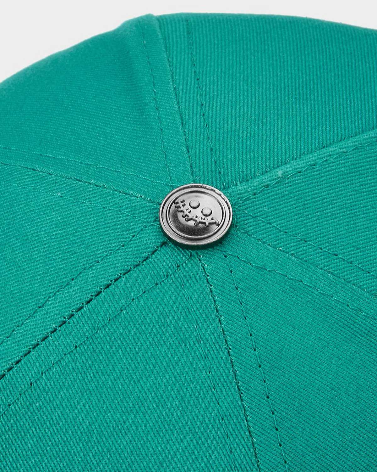 All Human Kilos V2 Trucker Hat Green/White, top view of the teal green crown