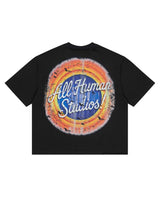All Human Like Mike Tee Black, back view with All Human Studios script in a sunburst roundel