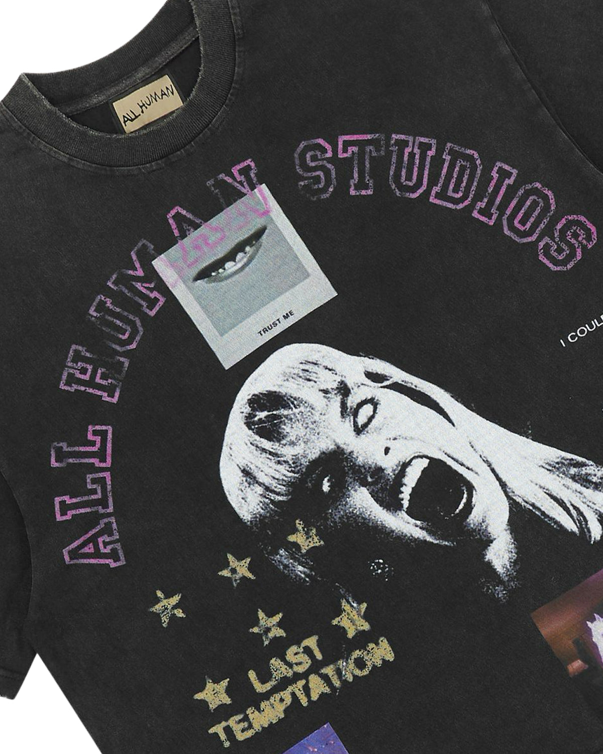 All Human Lithium Tee black wash, close-up of the All Human Studios arc lettering and Last Temptation print