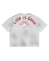All Human Love Me, Hate Me Tee White, back view with LIFE IS GOOD arched over a red sunrise