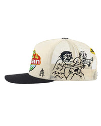 All Human Manson V2 Trucker Hat Cream/Black, close-up of the embroidered side panel