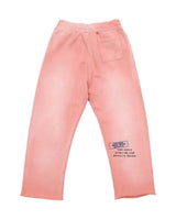 All Human Rehab Sweatpants pink wash, back view showing the Certified Bad Idea Service stamp and TOO MANY HUMANS, NOT ENOUGH SOULS text