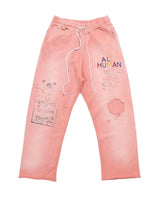 All Human Rehab Sweatpants pink wash, faded pink cotton fleece pants with multicolor ALL HUMAN lettering and crayon drawing prints, front view