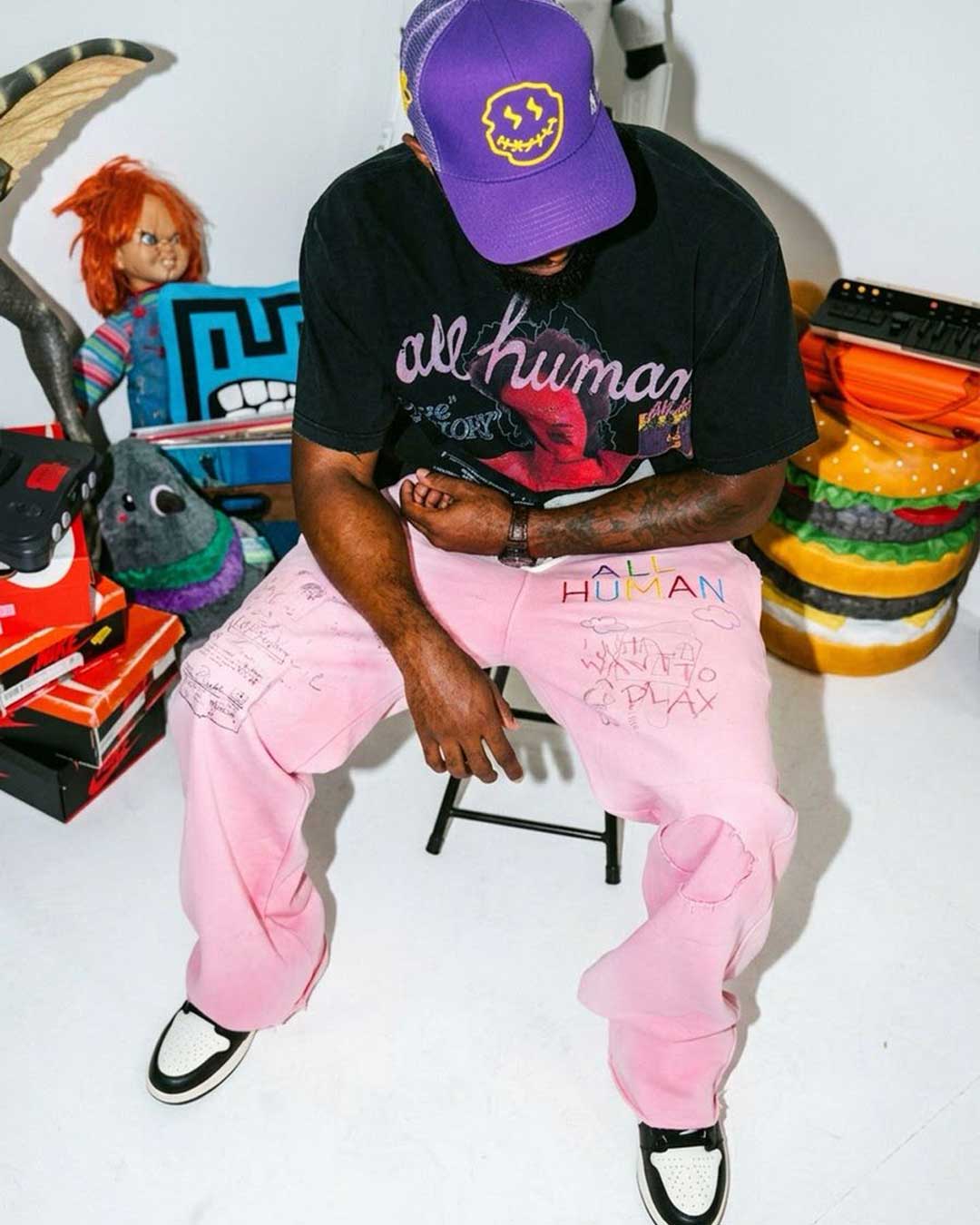 All Human Rehab Sweatpants pink wash, worn on model with a black All Human graphic tee