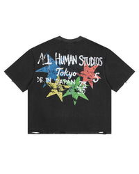 All Human Shinjuku Tee Black, back view with scrawled lettering over four multicoloured stars