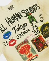 All Human Shinjuku Tee cream, close-up of the front Tokyo graphic with the green kaiju and NO FUTURE poster clipping