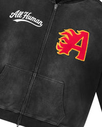 All Human Spit Fire V2 Sweatsuit black wash, close-up of the flame A patch and All Human script on the hoodie chest