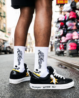 All Human The Sock V3 white, black and yellow, socks worn on foot with black sneakers