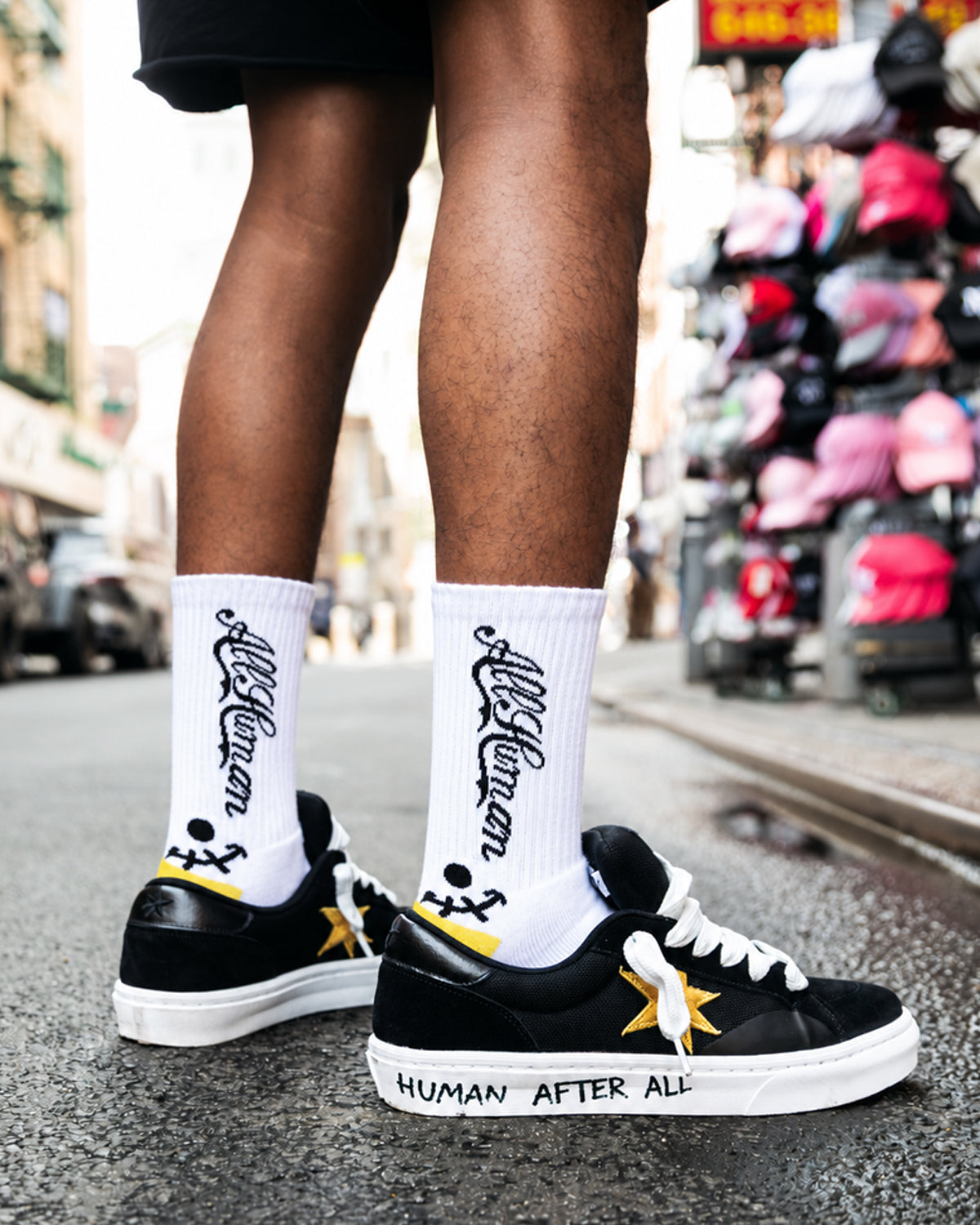 All Human The Sock V3 white, black and yellow, socks worn on foot with black sneakers