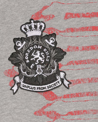 Boredom Kills Reality Sweatpants grey, close-up of the Unplug From Society crest patch and red script