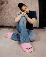 Bravest Studios Bear Claw Mule pink furry slip-on with claw detailing, female model wearing shoe