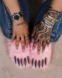 Bravest Studios Bear Claw Mule pink furry slip-on with claw detailing, model wearing overtop view