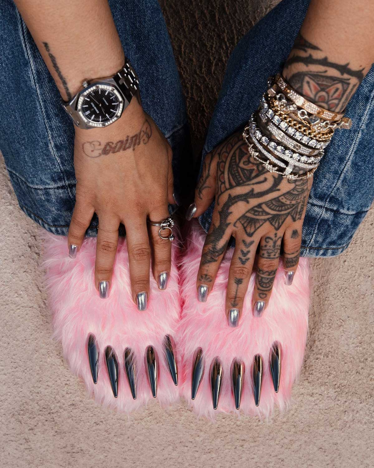 Bravest Studios Bear Claw Mule pink furry slip-on with claw detailing, model wearing overtop view