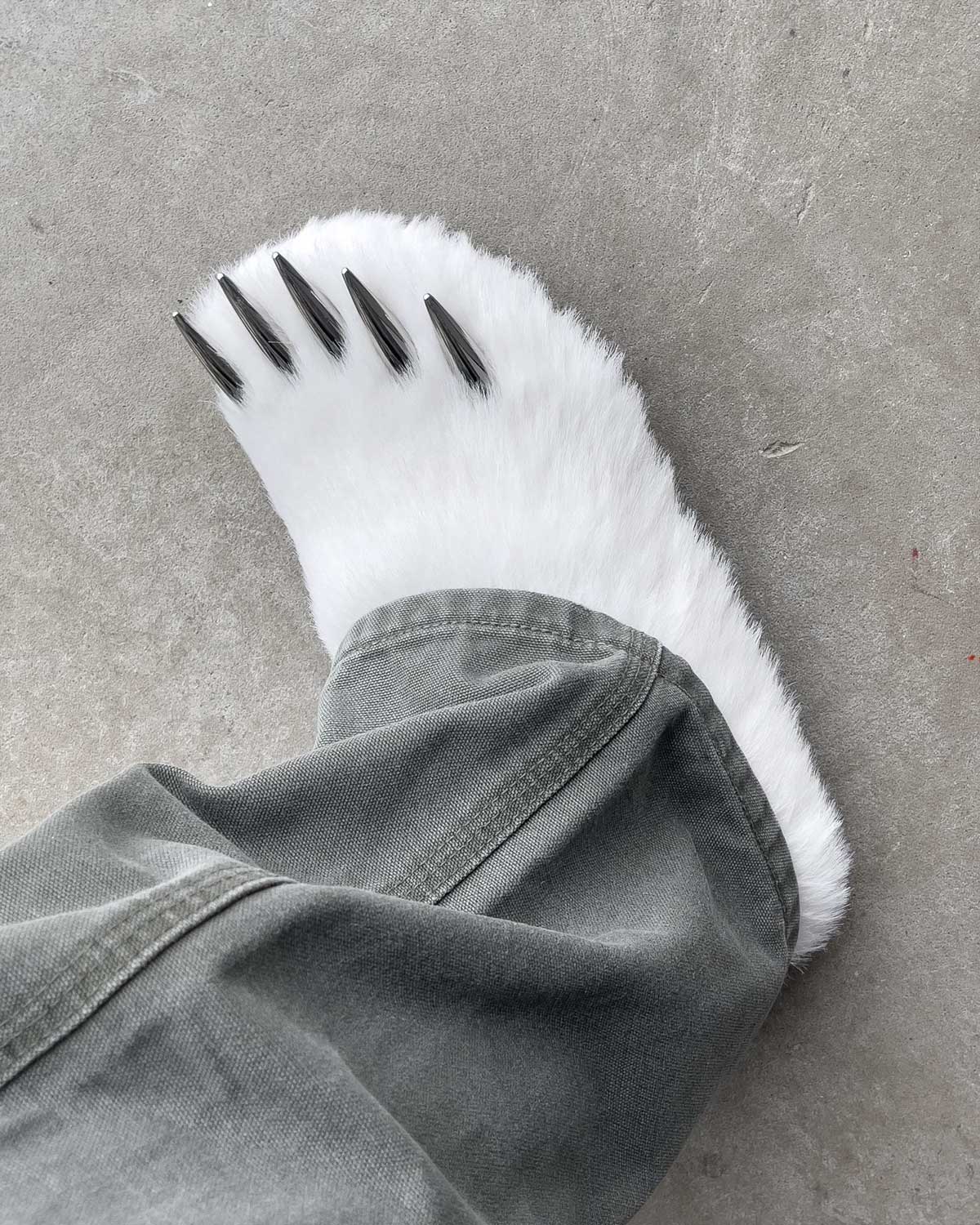 Bravest Studios Bear Claw Mule white furry slip-on with claw detailing, model on foot